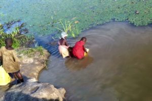 Children and animals share the same water source